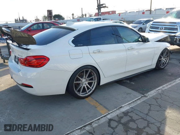 2018 BMW 4 Series 430i with VIN WBA4J1C59JBG77470, listed as a IAAI auction lot 41534689 with 141,710 mi miles and . Bid and sale history available at carsss.com. Image 4.