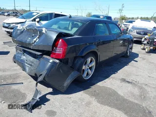 2005 Chrysler 300 with VIN 2C3AA63HX5H649107, listed as a IAAI auction lot 41748562 with 173,803 mi miles. Bid and sale history available at carsss.com. Image 4.