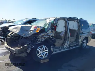 2005 Honda Odyssey EX-L with VIN 5FNRL38755B063203, listed as a IAAI auction lot 41073372 with Not provided miles and . Bid and sale history available at DreamBid. Image 6.