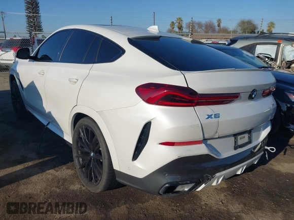 2021 BMW X6 sDrive40i z VIN 5UXCY4C06M9E16162, wystawiony jako IAAI lot #41279040 z przebiegiem 94 494 mil mil oraz . Historia ofert i sprzedaży dostępna na DreamBid. Obrazek 3.