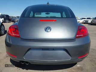 2014 Volkswagen Beetle 1.8T z VIN 3VWJ17AT9EM664866, wystawiony jako IAAI lot #42157223 z przebiegiem 36 381 mil mil oraz . Historia ofert i sprzedaży dostępna na DreamBid. Obrazek 17.