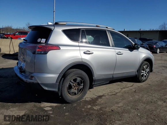 2016 Toyota RAV4 LE with VIN 2T3BFREV4GW451616, listed as a Copart auction lot 50143575 with 128,034 mi miles and Salvage Title. Bid and sale history available at DreamBid. Image 3.