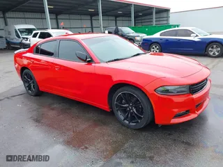 2017 Dodge Charger SXT with VIN 2C3CDXHG9HH581053, listed as a IAAI auction lot 42002202 with 127,218 mi miles. Bid and sale history available at carsss.com. Image 1.