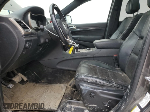 2014 Jeep Grand Cherokee Summit с VIN 1C4RJFJG4EC427075, выставлен на аукционе Copart как лот 49504095 с пробегом 147 342 миль миль и Списание • Salvage title. История ставок и продаж доступна на DreamBid. Изображение 7.