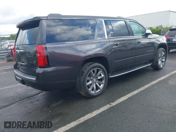 2015 Chevrolet Suburban LTZ with VIN 1GNSKKKC4FR589913, listed as a IAAI auction lot 42017190 with 216,145 mi miles. Bid and sale history available at carsss.com. Image 4.