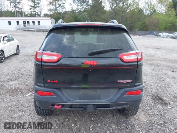 2015 Jeep Cherokee Trailhawk with VIN 1C4PJMBS5FW792184, listed as a IAAI auction lot 41827106 with 132,752 mi miles. Bid and sale history available at carsss.com. Image 16.