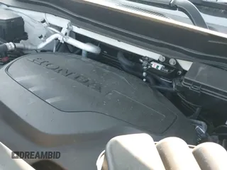 2023 Honda Passport TrailSport with VIN 5FNYF8H66PB004297, listed as a IAAI auction lot 42407299 with 19,222 mi miles and . Bid and sale history available at DreamBid. Image 19.