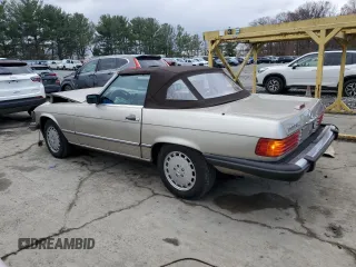 1989 Mercedes-Benz 560 SL with VIN WDBBA48D0KA099001, listed as a Copart auction lot 82129274 with 95,805 mi miles and Clean Title. Bid and sale history available at DreamBid. Image 2.
