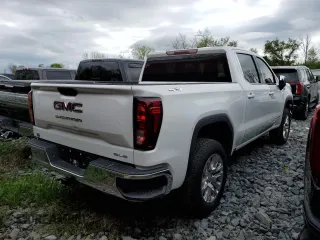 2023 GMC Sierra 1500 with VIN 1GTUUBE84PZ327510, listed as a Copart auction lot 51716385 with 30,590 mi miles and Salvage Title. Bid and sale history available at DreamBid. Image 3.