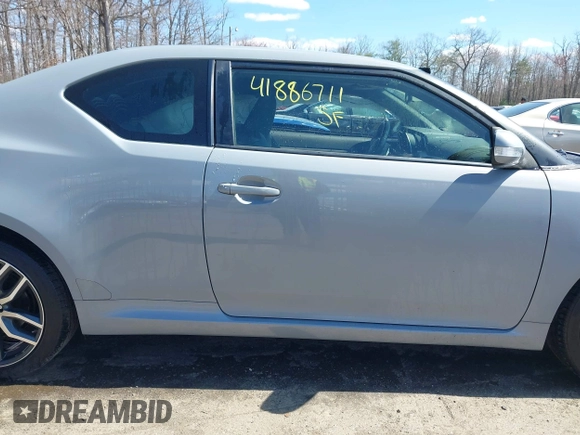 2014 Scion tC with VIN JTKJF5C70E3083839, listed as a IAAI auction lot 41886711 with 118,029 mi miles. Bid and sale history available at carsss.com. Image 13.