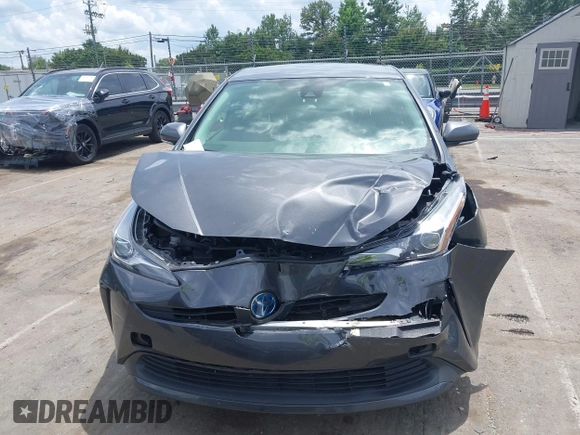 2021 Toyota Prius L Eco z VIN JTDKAMFU3M3152785, wystawiony jako IAAI lot #42501351 z przebiegiem 60 489 mil mil oraz . Historia ofert i sprzedaży dostępna na DreamBid. Obrazek 12.