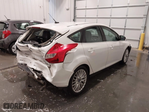 2014 Ford Focus Titanium with VIN 1FADP3N27EL110287, listed as a IAAI auction lot 42210697 with 107,741 mi miles and . Bid and sale history available at DreamBid. Image 4.