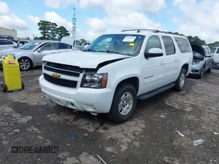 2014 Chevrolet Suburban LT with VIN 1GNSCJE07ER211222, listed as a IAAI auction lot 42428084 with 214,712 mi miles and . Bid and sale history available at DreamBid. Image 2.