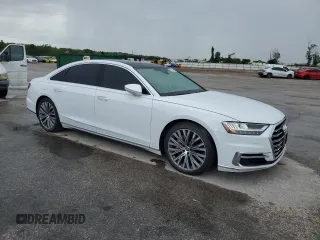 2019 Audi A8 z VIN WAU8DAF88KN004066, wystawiony jako Copart lot #56928395 z przebiegiem 93 157 mil mil oraz Czysty tytuł • Clean title. Historia ofert i sprzedaży dostępna na DreamBid. Obrazek 4.