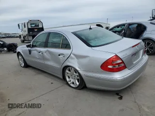 2003 Mercedes-Benz E-Class 5.0L with VIN WDBUF70J03A112909, listed as a Copart auction lot 49924865 with 158,244 mi miles and Salvage Title. Bid and sale history available at carsss.com. Image 2.
