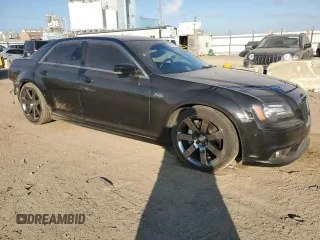 2013 Chrysler 300 SRT-8 with VIN 2C3CCAFJ8DH646483, listed as a Copart auction lot 83261144 with 86,015 mi miles and Salvage Title. Bid and sale history available at DreamBid. Image 4.