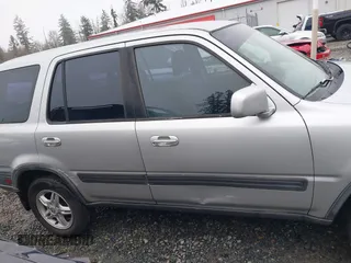 1999 Honda CR-V EX with VIN JHLRD1866XC033865, listed as a IAAI auction lot 41219896 with 142,396 mi miles. Bid and sale history available at carsss.com. Image 13.