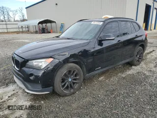 2015 BMW X1 xDrive28i with VIN WBAVL1C50FVY33039, listed as a Copart auction lot 88310945 with 114,029 mi miles and Salvage Title. Bid and sale history available at carsss.com. Image 1.