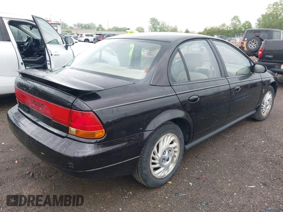 1999 Saturn SL with VIN 1G8ZK5272XZ263163, listed as a IAAI auction lot 42180002 with 138,463 mi miles. Bid and sale history available at carsss.com. Image 4.