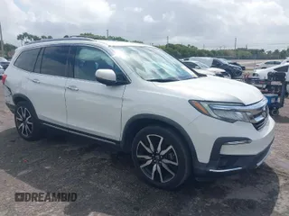 2020 Honda Pilot Elite with VIN 5FNYF6H05LB053582, listed as a IAAI auction lot 41721168 with 56,770 mi miles and . Bid and sale history available at DreamBid. Image 1.