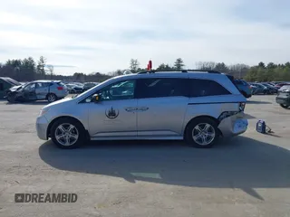 2012 Honda Odyssey Touring with VIN 5FNRL5H95CB063003, listed as a IAAI auction lot 41871975 with 179,332 mi miles and . Bid and sale history available at DreamBid. Image 14.