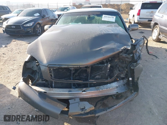 2002 Cadillac DeVille DHS z VIN 1G6KE57Y52U283531, wystawiony jako IAAI lot #41640930 z przebiegiem 94 435 mil mil oraz . Historia ofert i sprzedaży dostępna na DreamBid. Obrazek 6.