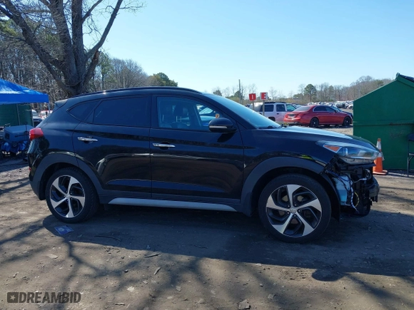 2018 Hyundai Tucson Value with VIN KM8J3CA26JU713729, listed as a IAAI auction lot 41950946 with 73,456 mi miles. Bid and sale history available at carsss.com. Image 14.