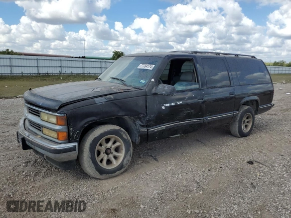 1999 Chevrolet Suburban with VIN 3GNEC16R7XG141671, listed as a Copart auction lot 77784174 with 207,234 mi miles and Salvage Title. Bid and sale history available at carsss.com. Image 1.