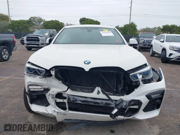 2021 BMW X6 xDrive40i z VIN 5UXCY6C00M9F88215, wystawiony jako IAAI lot #41646498 z przebiegiem 43 587 mil mil oraz . Historia ofert i sprzedaży dostępna na DreamBid. Obrazek 12.