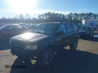 2003 Isuzu Rodeo with VIN 4S2CK58W034303195, listed as a IAAI auction lot 41219379 with 215,821 mi miles and . Bid and sale history available at DreamBid. Image 2.
