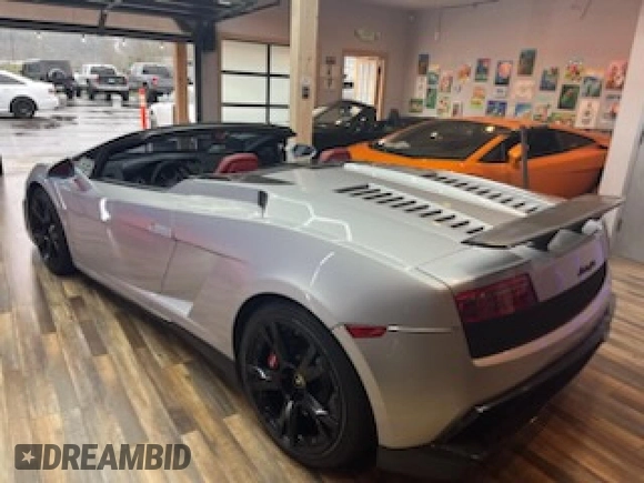 2013 Lamborghini Gallardo z VIN ZHWGU6BZ7DLA12511, wystawiony jako Copart lot #85780924 z przebiegiem 35 386 mil mil oraz Szkody całkowita. Historia ofert i sprzedaży dostępna na DreamBid. Obrazek 3.