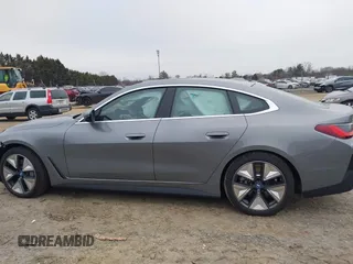 2024 BMW i4 eDrive35 z VIN WBY43AW05RFT22034, wystawiony jako IAAI lot #41545162 z przebiegiem 1499 mil mil oraz . Historia ofert i sprzedaży dostępna na DreamBid. Obrazek 14.