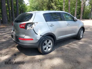 2012 Kia Sportage LX with VIN KNDPB3A22C7342085, listed as a IAAI auction lot 42313425 with 112,005 mi miles and . Bid and sale history available at DreamBid. Image 4.
