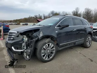 2017 Cadillac XT5 Premium Luxury AWD z VIN 1GYKNERS5HZ166592, wystawiony jako Copart lot #48053555 z przebiegiem 124 104 mil mil oraz Szkody całkowita. Historia ofert i sprzedaży dostępna na DreamBid. Obrazek 1.