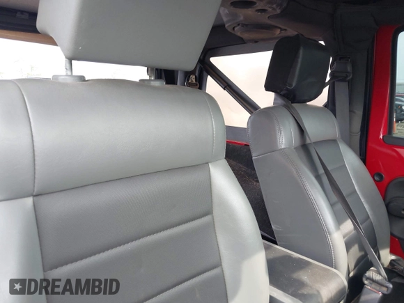 2009 Jeep Wrangler X with VIN 1J4FA24129L716085, listed as a IAAI auction lot 42425012 with 118,859 mi miles and . Bid and sale history available at DreamBid. Image 8.