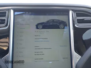 2014 Tesla Model S 60 z VIN 5YJSA1H19EFP45024, wystawiony jako IAAI lot #41960222 z przebiegiem 108 573 mil mil oraz . Historia ofert i sprzedaży dostępna na DreamBid. Obrazek 7.