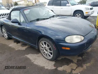 1999 Mazda MX-5 Miata z VIN JM1NB3531X0121523, wystawiony jako IAAI lot #41939387 z przebiegiem 120 597 mil mil oraz . Historia ofert i sprzedaży dostępna na DreamBid. Obrazek 1.