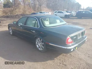 2004 Jaguar XJ with VIN SAJWA71C74SG22814, listed as a IAAI auction lot 41649399 with 114,841 mi miles. Bid and sale history available at carsss.com. Image 3.