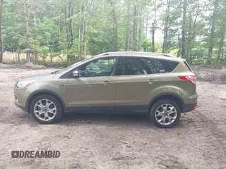 2014 Ford Escape Titanium with VIN 1FMCU9JX9EUB23972, listed as a IAAI auction lot 42217298 with 164,556 mi miles and . Bid and sale history available at DreamBid. Image 14.