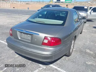 2002 Mercury Sable GS with VIN 1MEFM50U92A613552, listed as a IAAI auction lot 41718804 with 211,661 mi miles. Bid and sale history available at carsss.com. Image 4.