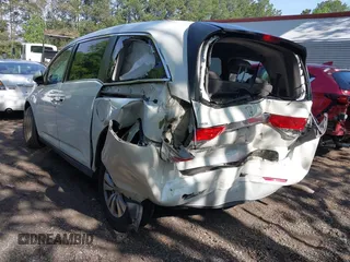 2014 Honda Odyssey EX-L with VIN 5FNRL5H63EB064854, listed as a IAAI auction lot 42102704 with 148,536 mi miles and . Bid and sale history available at carsss.com. Image 3.