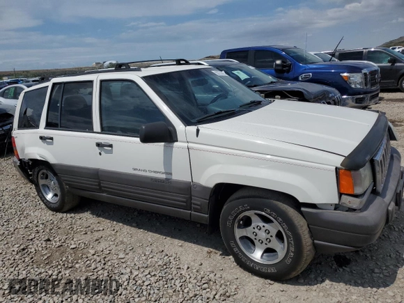 1998 Jeep Grand Cherokee Laredo with VIN 1J4GZ58S4WC244954, listed as a Copart auction lot 55731465 with 205,766 mi miles and Salvage title. Bid and sale history available at DreamBid. Image 4.