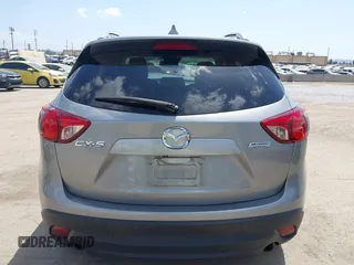 2014 Mazda CX-5 Touring z VIN JM3KE2CYXE0322943, wystawiony jako IAAI lot #41934670 z przebiegiem 110 690 mil mil oraz . Historia ofert i sprzedaży dostępna na DreamBid. Obrazek 16.