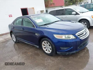 2011 Ford Taurus SE with VIN 1FAHP2DW7BG128857, listed as a IAAI auction lot 41705643 with 163,589 mi miles. Bid and sale history available at carsss.com. Image 1.