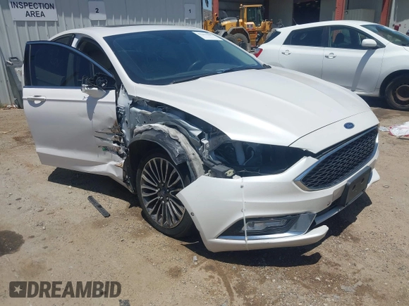 2017 Ford Fusion Titanium z VIN 3FA6P0SU0HR329224, wystawiony jako IAAI lot #42291605 z przebiegiem 176 728 mil mil oraz . Historia ofert i sprzedaży dostępna na DreamBid. Obrazek 1.