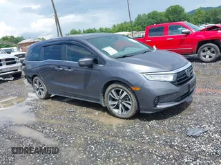 2021 Honda Odyssey Touring with VIN 5FNRL6H86MB013953, listed as a IAAI auction lot 42509136 with 79,185 mi miles and . Bid and sale history available at DreamBid. Image 1.