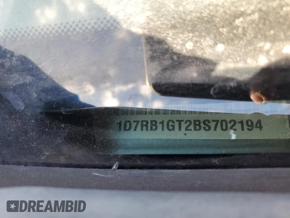2011 Ram 1500 SLT with VIN 1D7RB1GT2BS702194, listed as a Copart auction lot 81380894 with 198,608 mi miles and Salvage title. Bid and sale history available at DreamBid. Image 12.