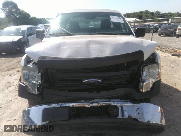 2014 Ford F-150 XL with VIN 1FTMF1CM0EKG51659, listed as a IAAI auction lot 42502648 with 99,450 mi miles and . Bid and sale history available at DreamBid. Image 6.