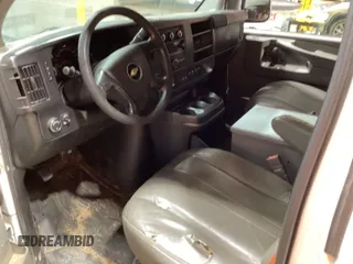 2015 Chevrolet Express Cargo Van with VIN 1GCWGFCF8F1233846, listed as a IAAI auction lot 42154744 with 283,877 mi miles. Bid and sale history available at carsss.com. Image 1.