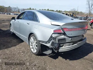 2015 Lincoln MKZ with VIN 3LN6L2G9XFR607285, listed as a IAAI auction lot 41572389 with 138,899 mi miles and . Bid and sale history available at DreamBid. Image 3.